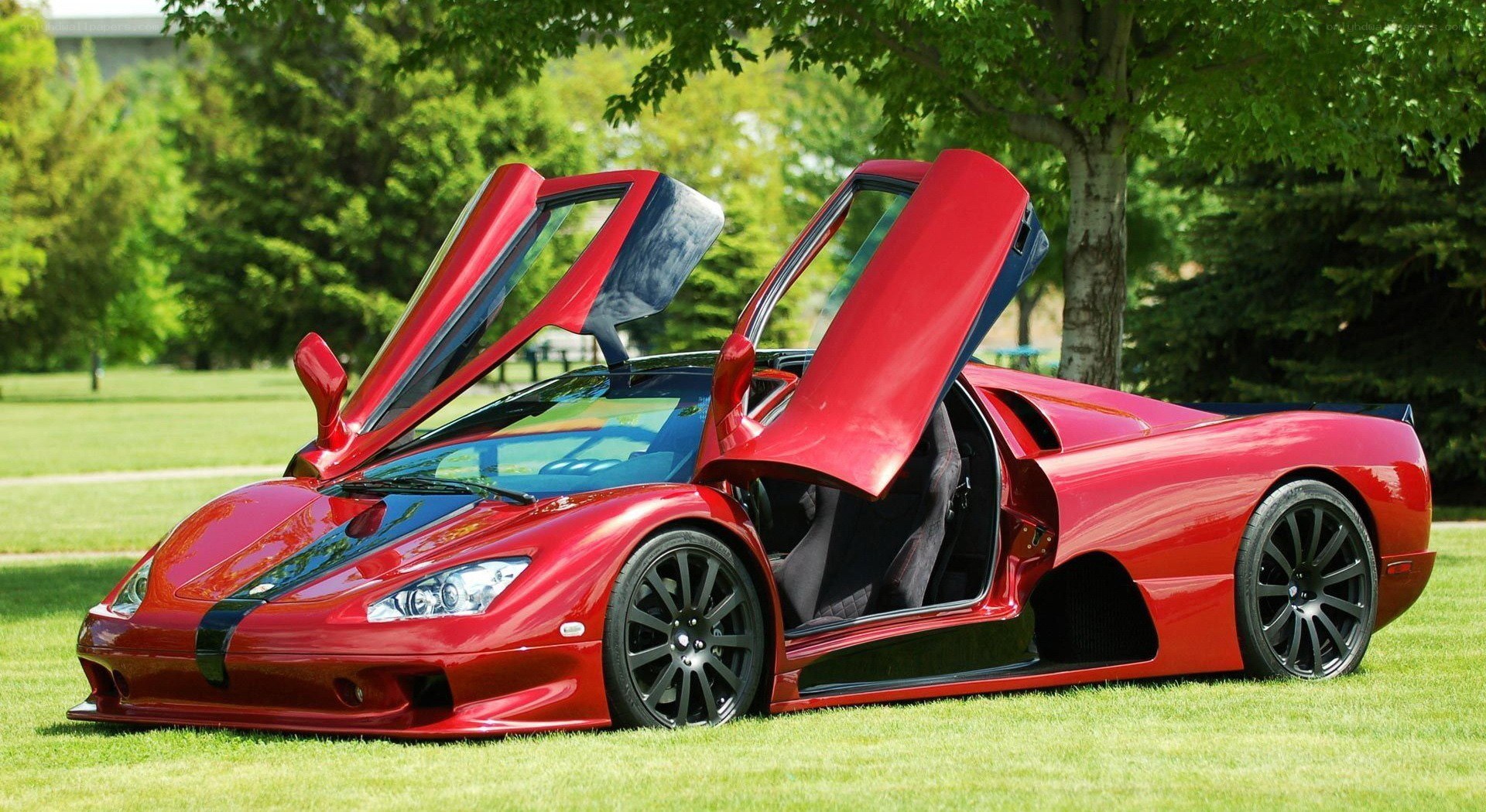 Red supercar with open doors
