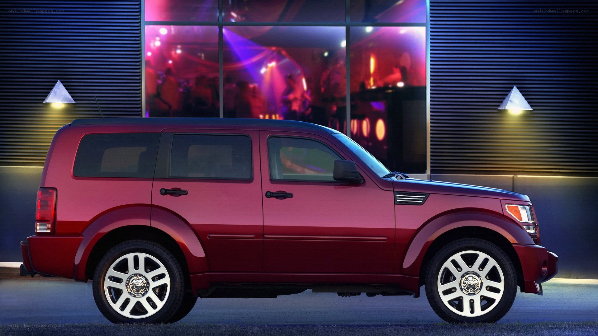 Red SUV at night