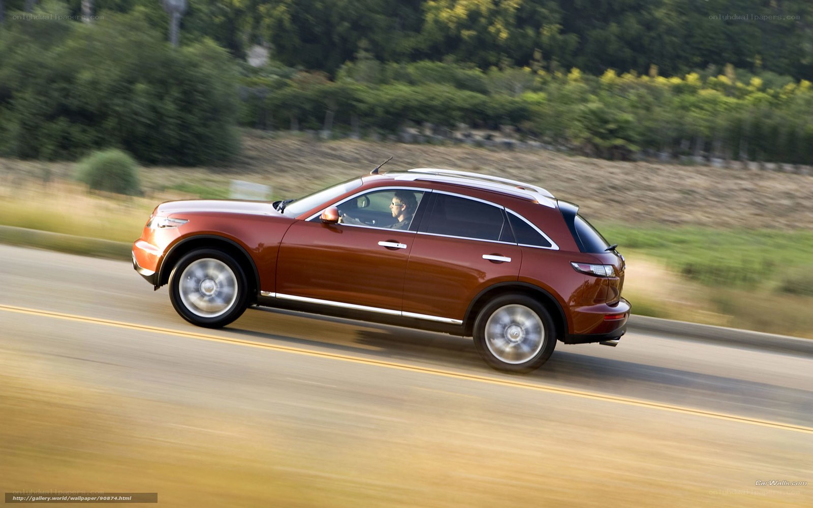 red suv driving on road