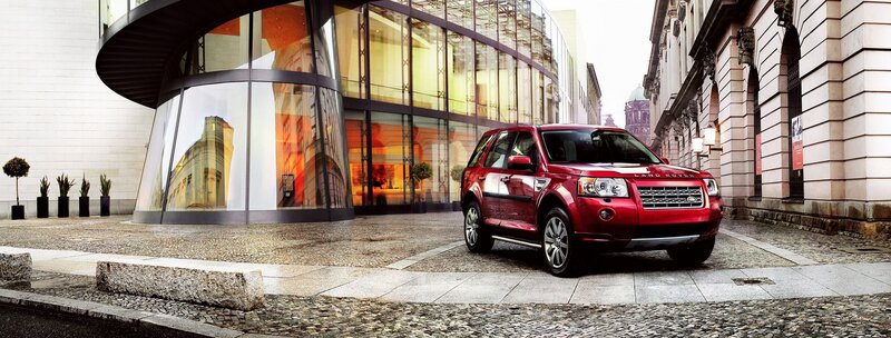 Red SUV in city street