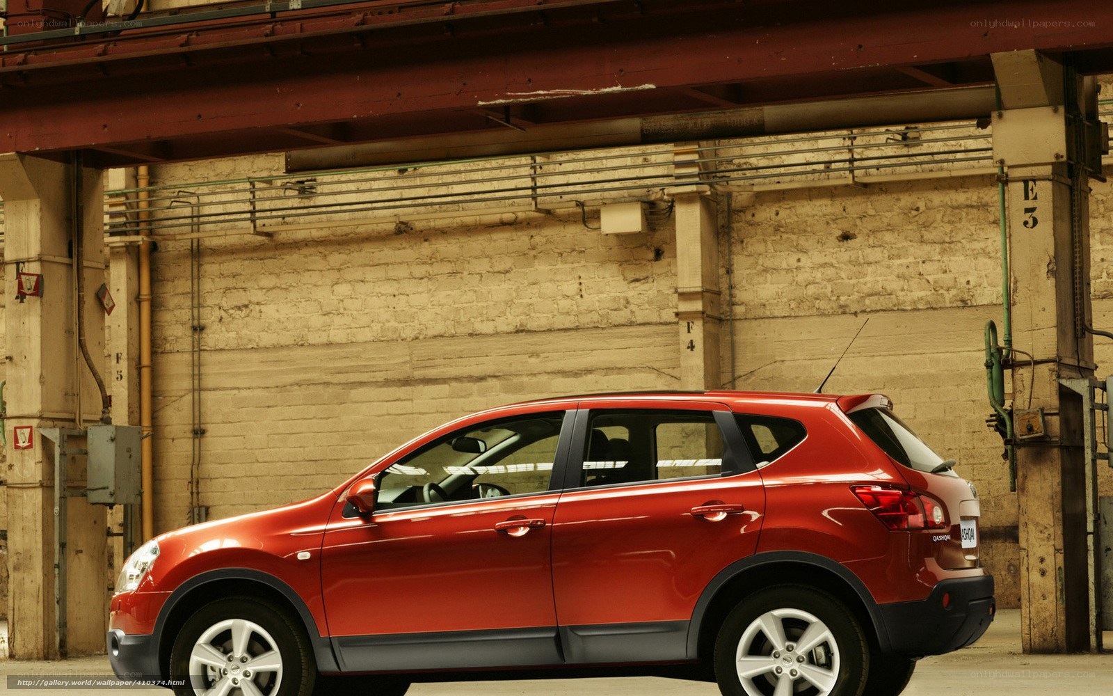 Red SUV in industrial setting