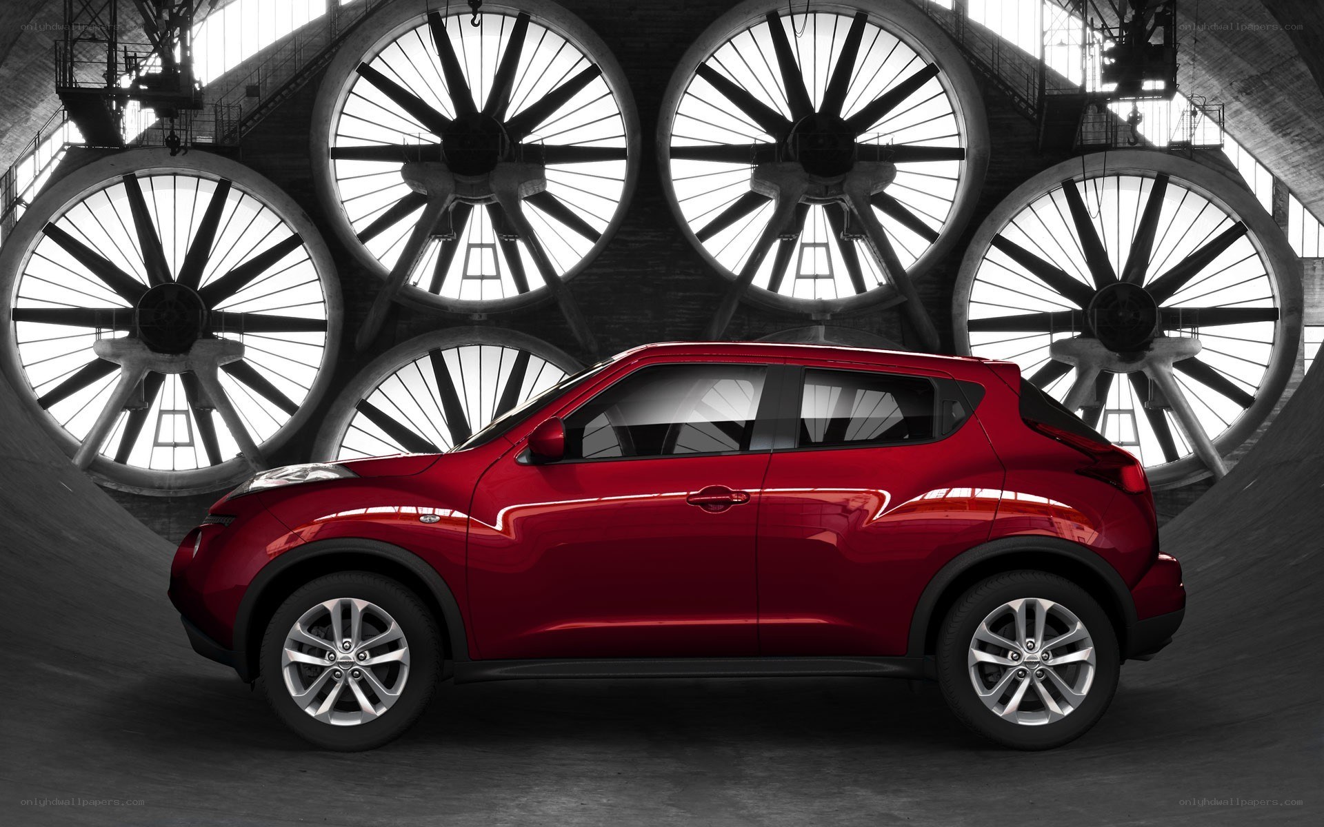 Red SUV in industrial setting