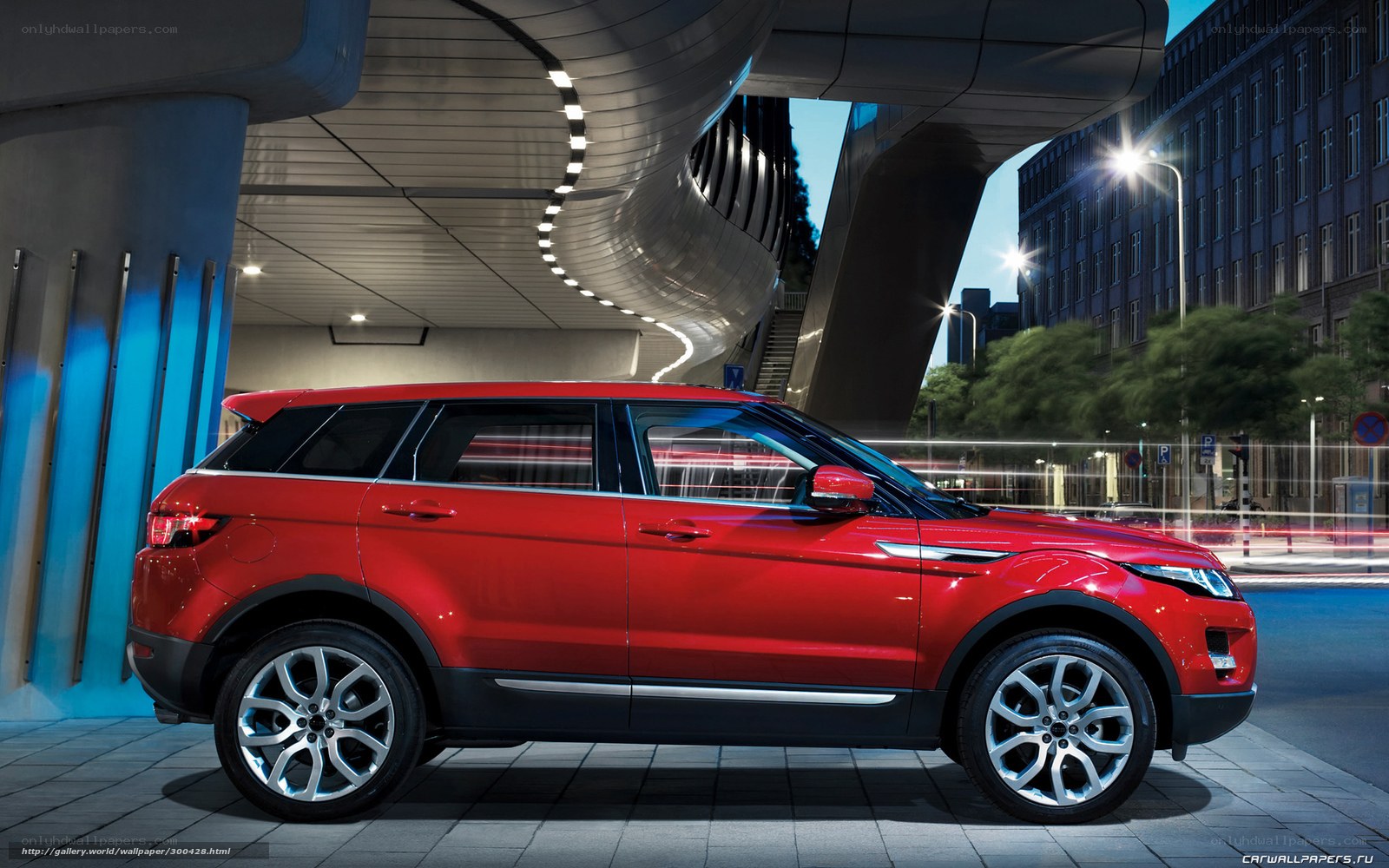 Red SUV in modern city