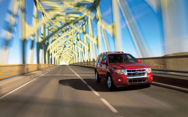 Red SUV on a bridge