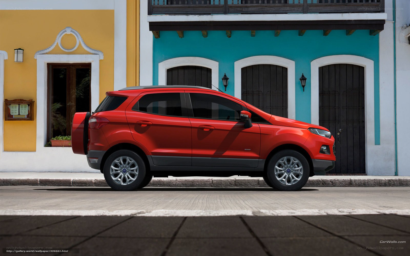 Red SUV on a colorful street