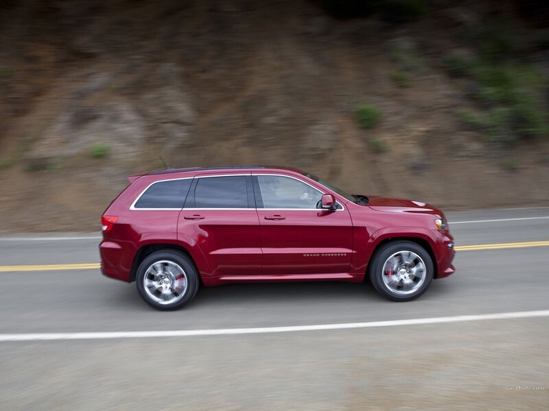 red suv on a road