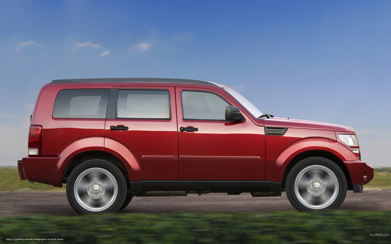 red suv on a road