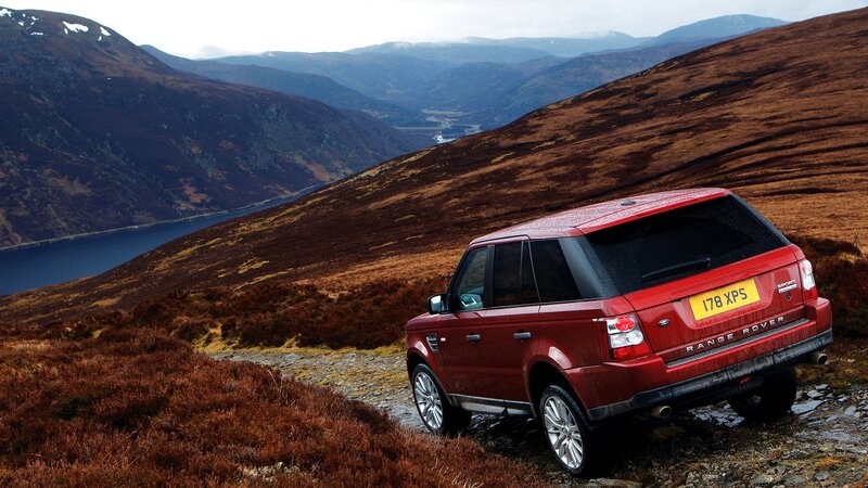 Red SUV on Hillside