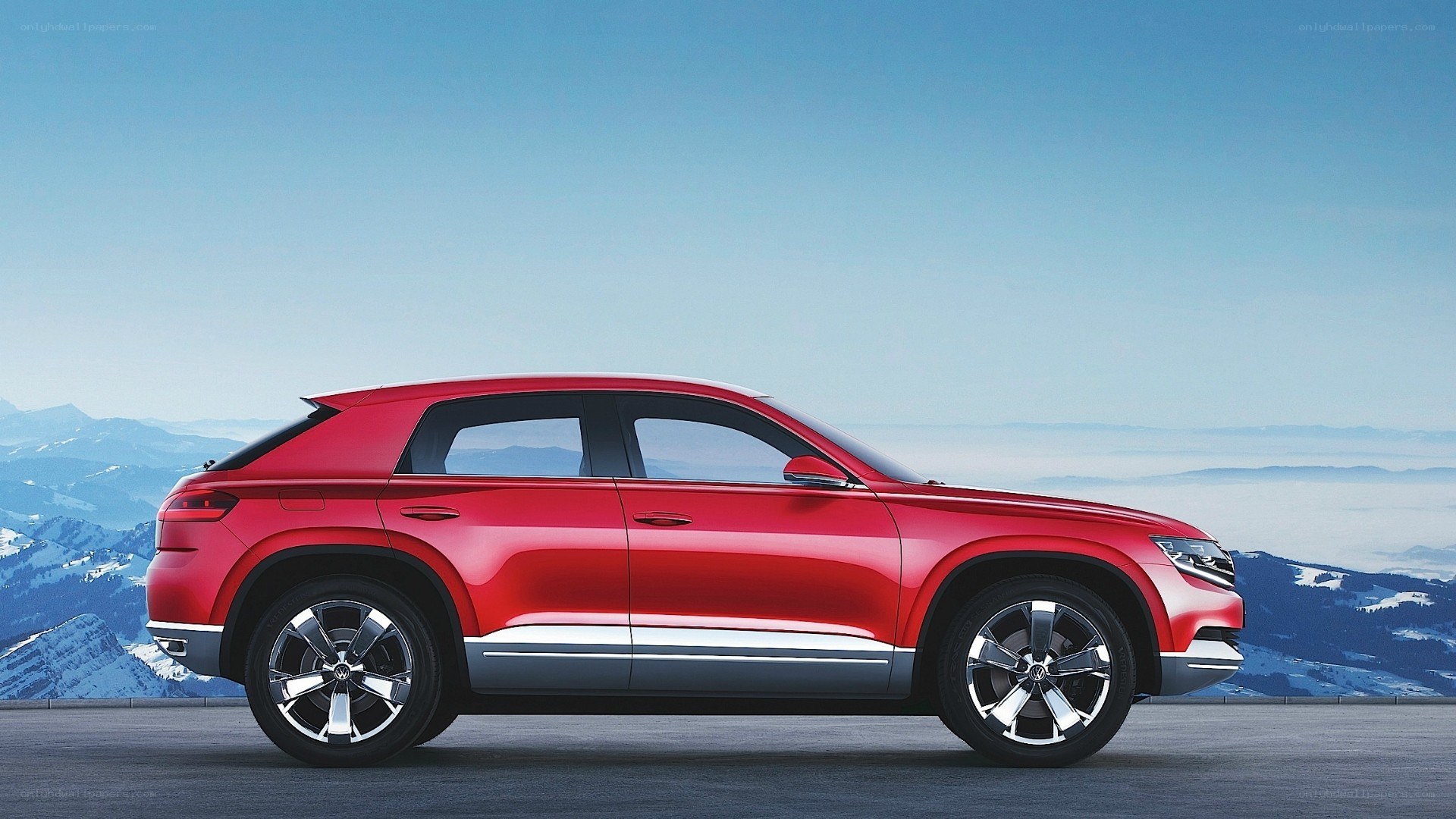 Red SUV on mountain road