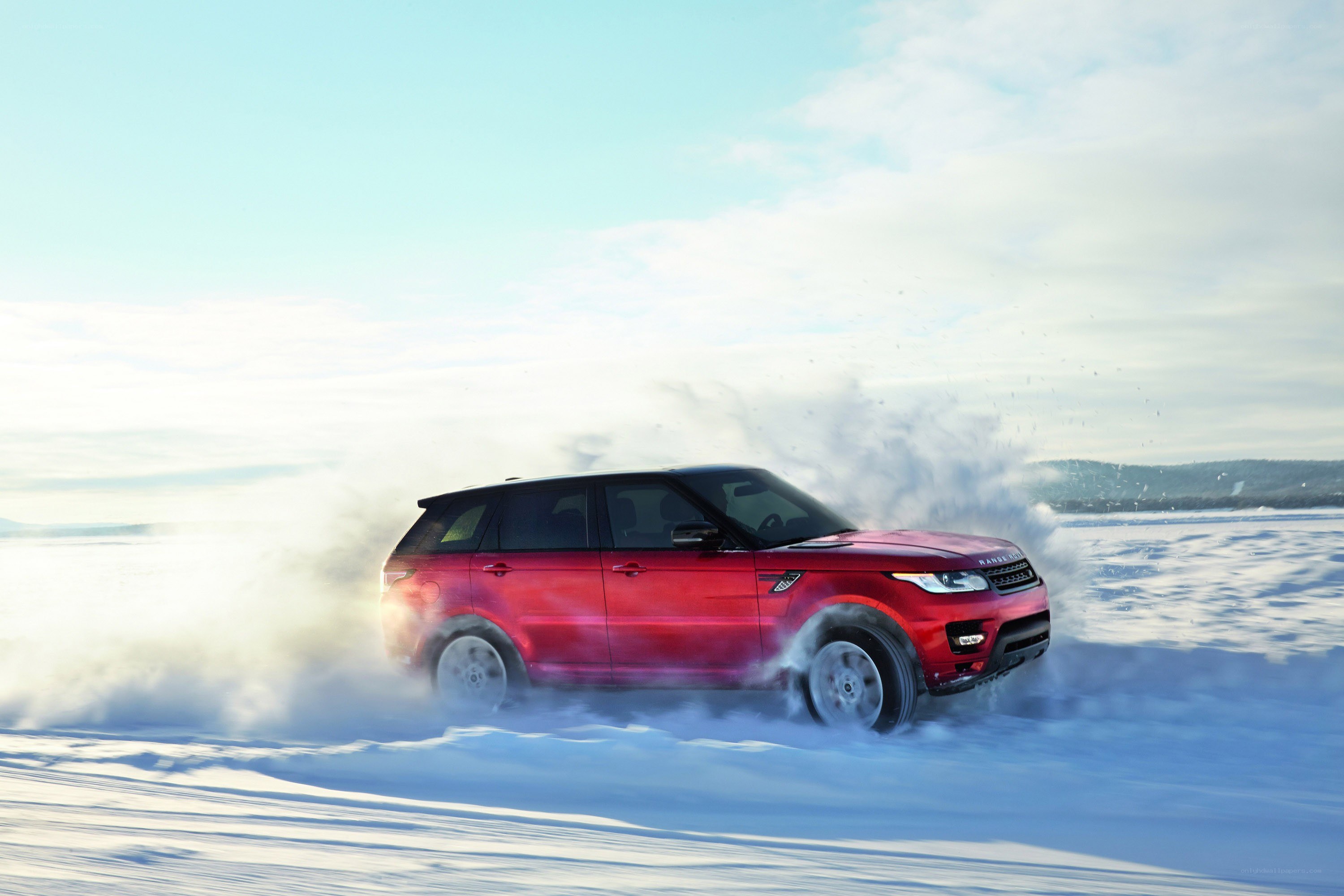 Red SUV on snowy terrain