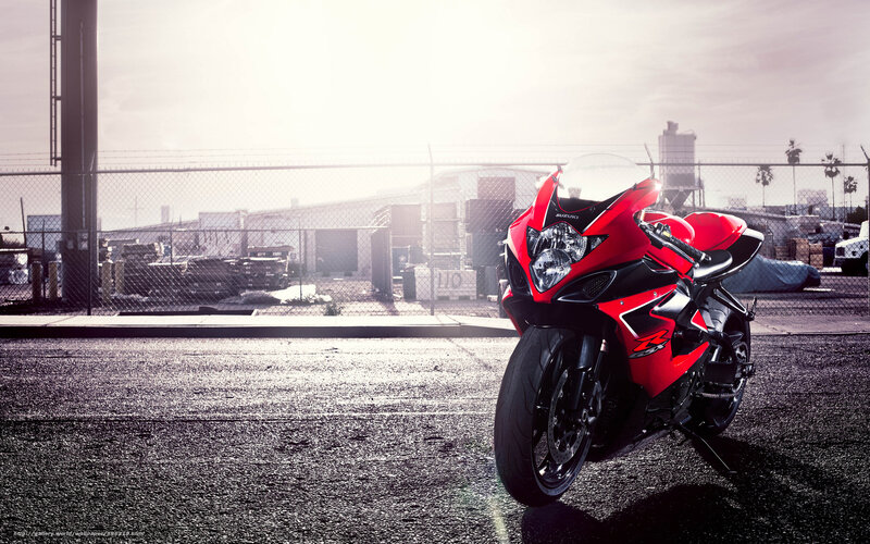 Red Suzuki sportbike in industrial lot