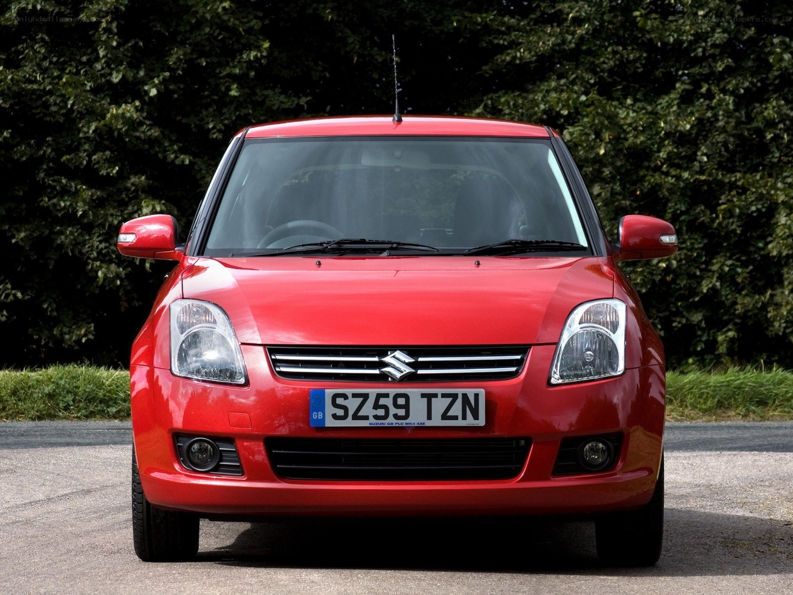 red suzuki swift car