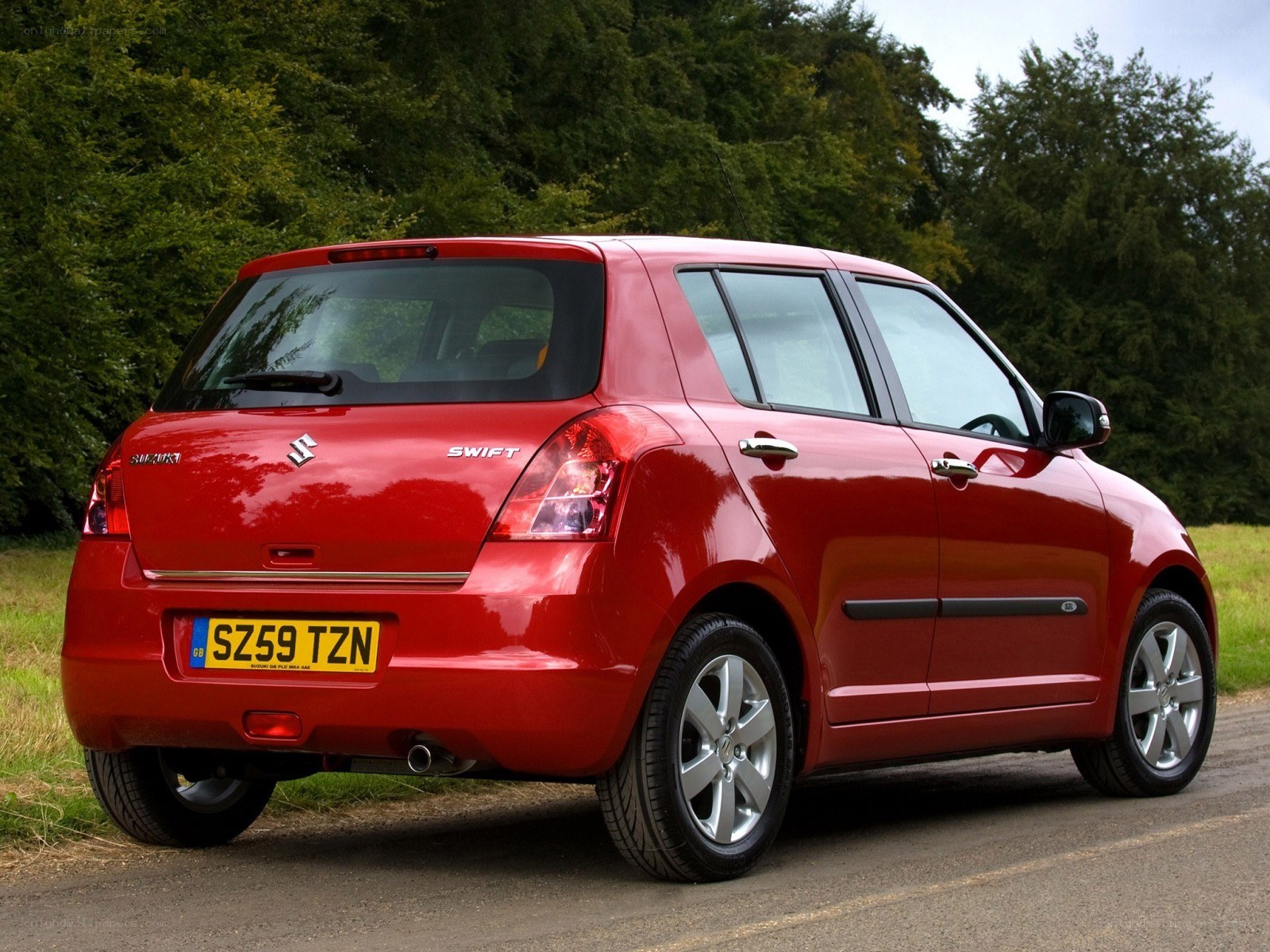 Red Suzuki Swift hatchback