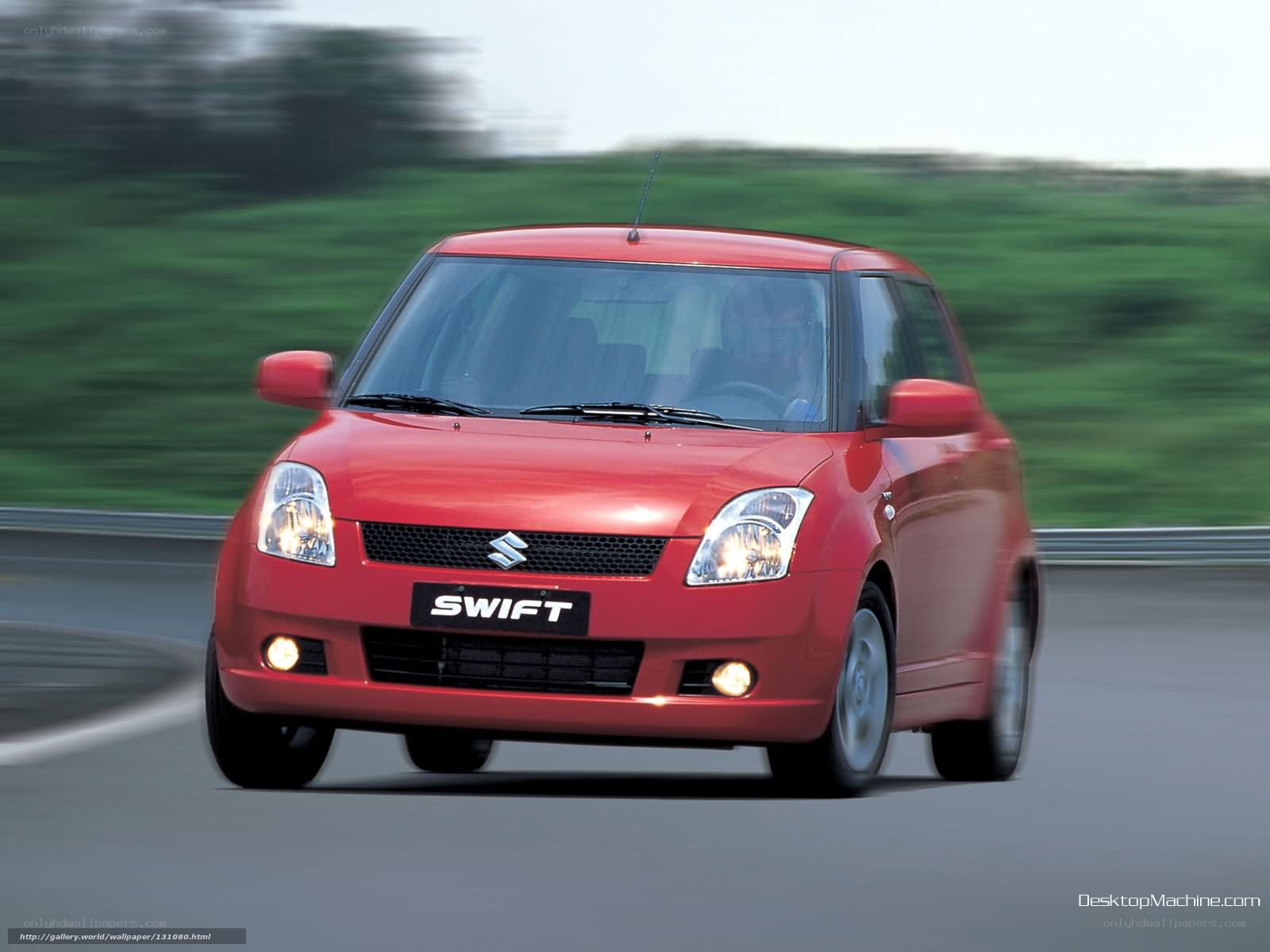Red Suzuki Swift in motion