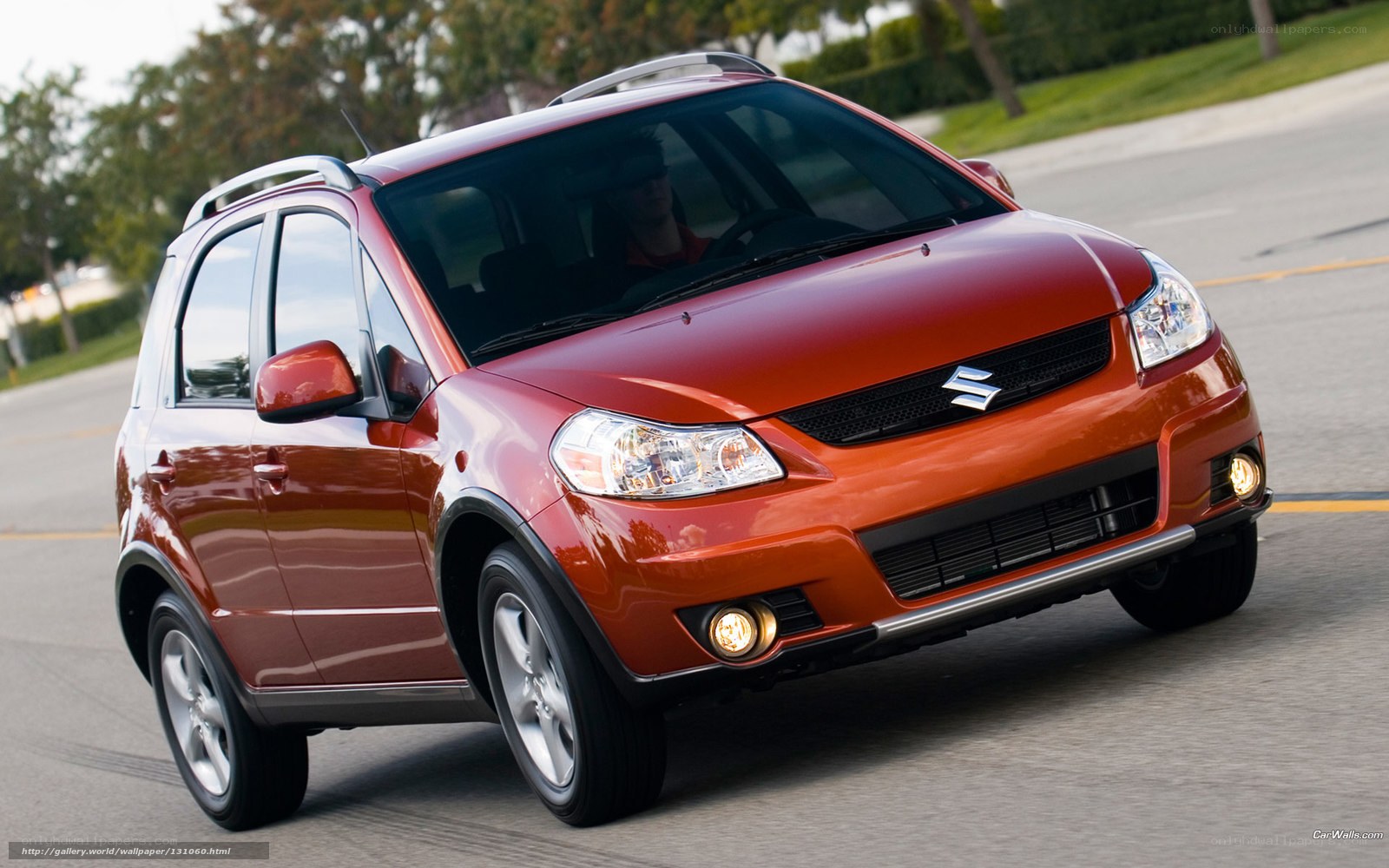 red suzuki sx4 in motion