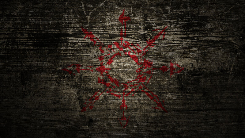 red symbol on dark wood