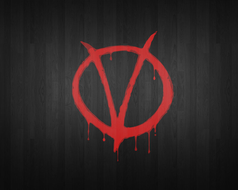 red symbol on dark wood