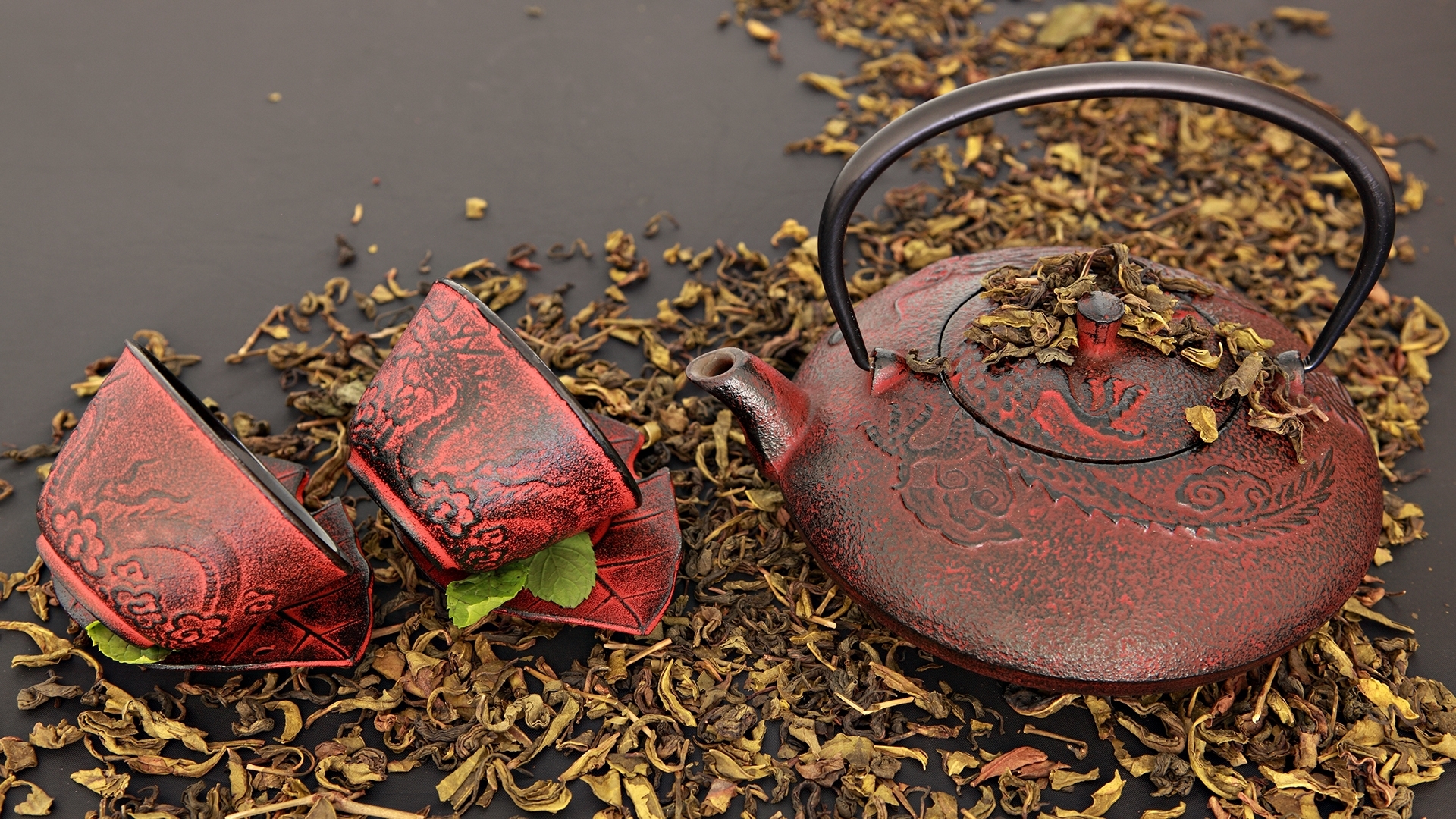 Red tea set with dried leaves