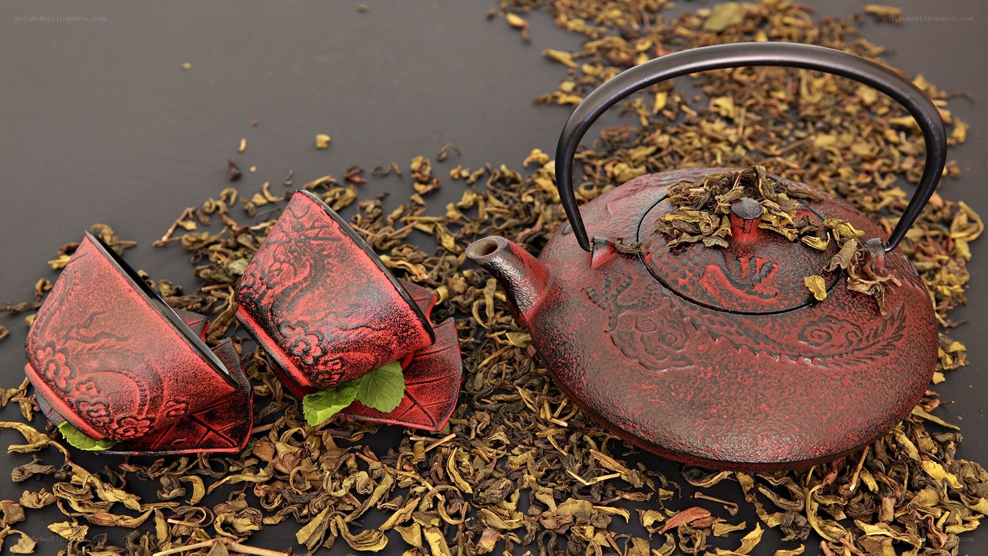 Red tea set with dried leaves