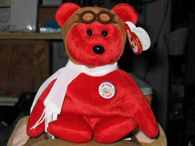 Red teddy bear with aviator gear