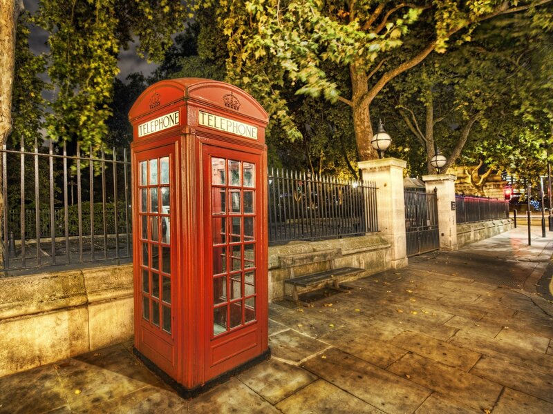 Red telephone box at night