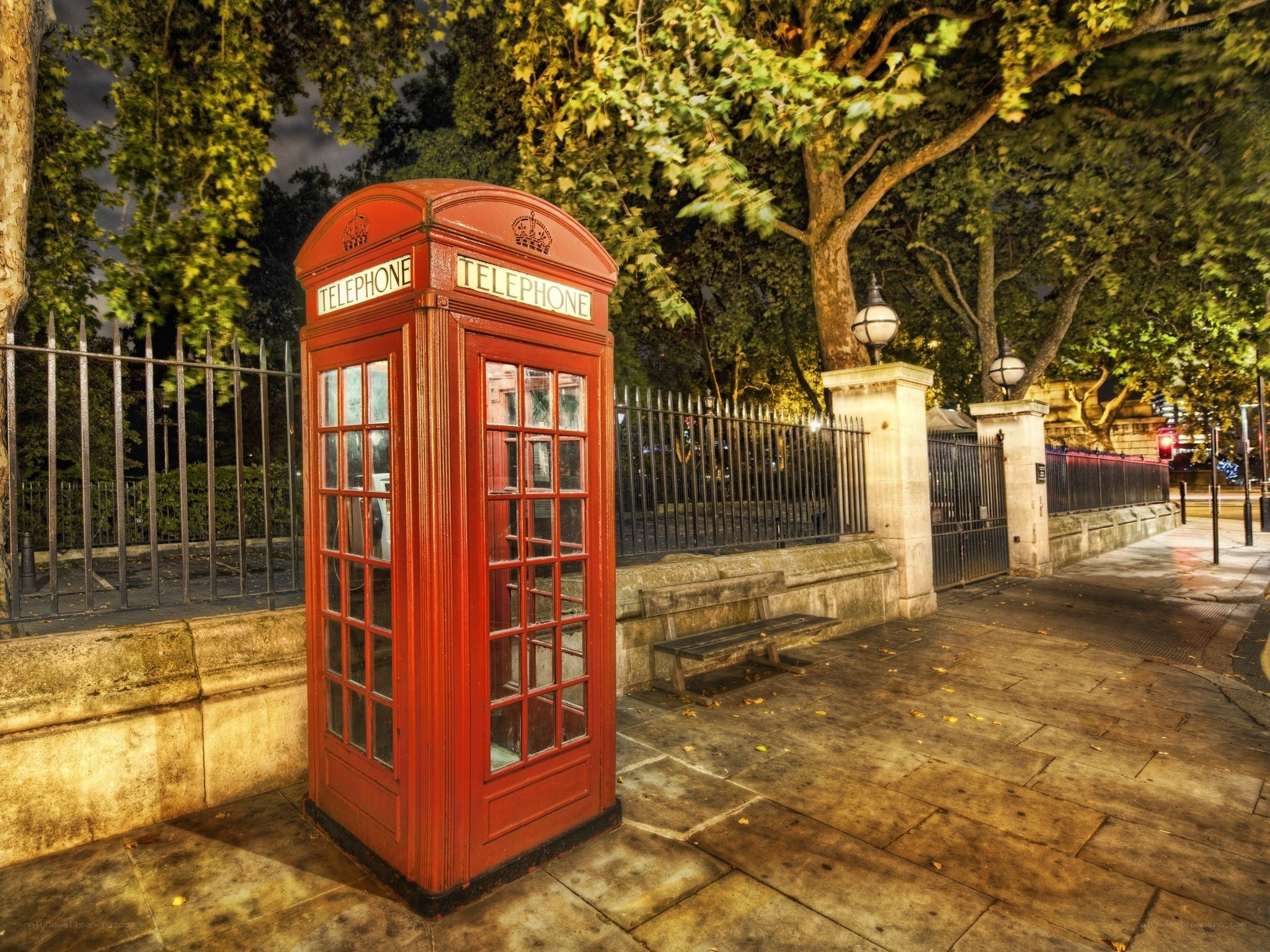 Red telephone box at night