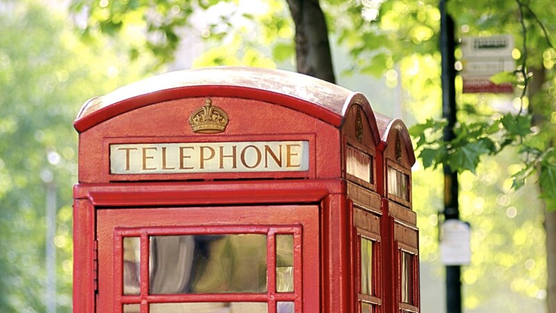 Red telephone box in park