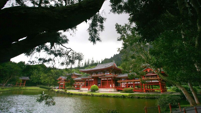 red temple by a pond