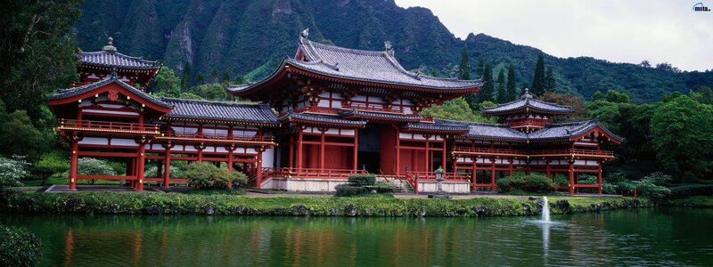 red temple by a pond