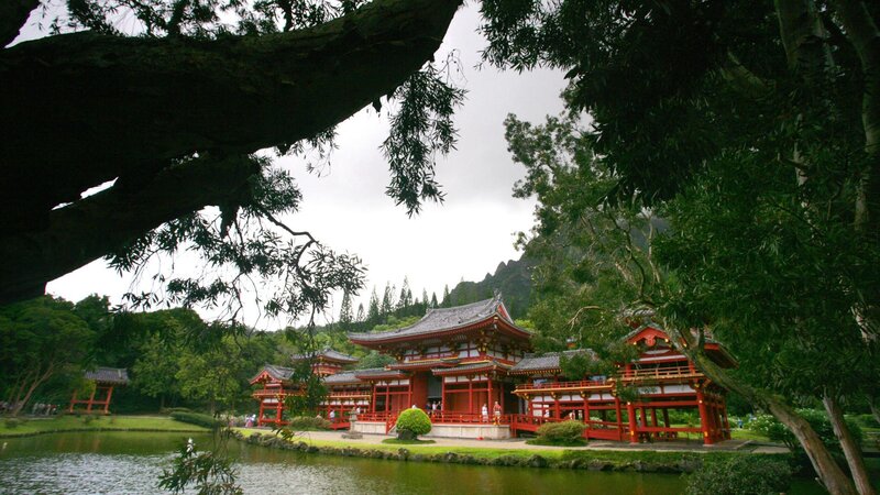 red temple by pond
