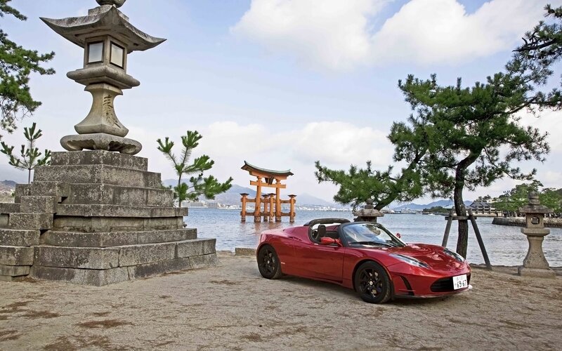Red Tesla Roadster at Itsukushima Shrine
