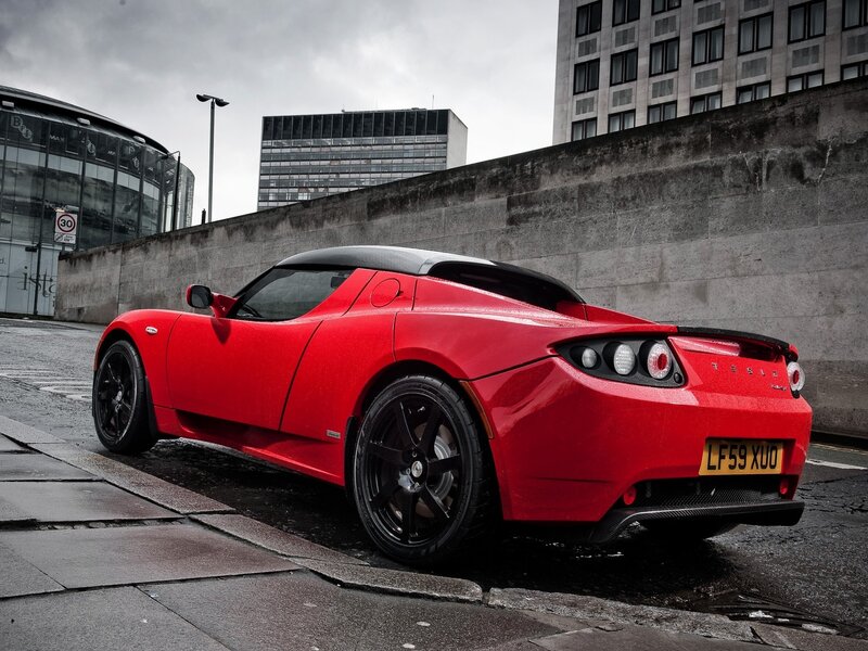 Red Tesla Roadster — Dramatic, Photograph, Car, Building