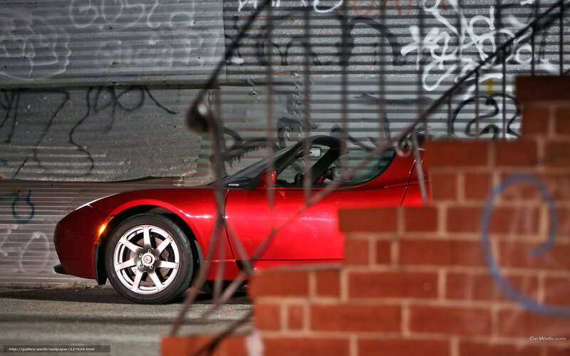 Red Tesla Roadster in alley