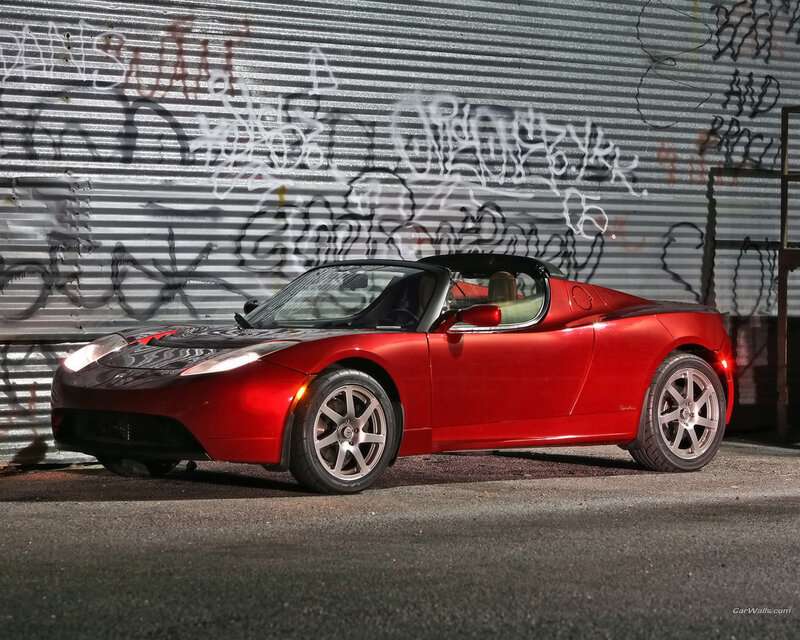 Red Tesla Roadster in alley