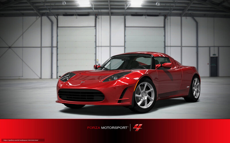 Red Tesla Roadster in garage
