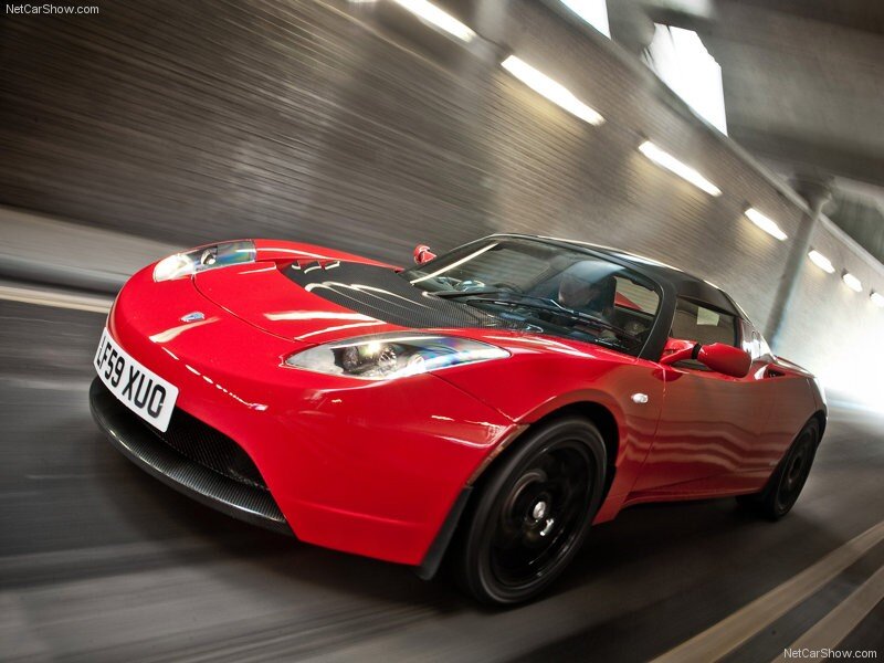 Red Tesla Roadster in tunnel