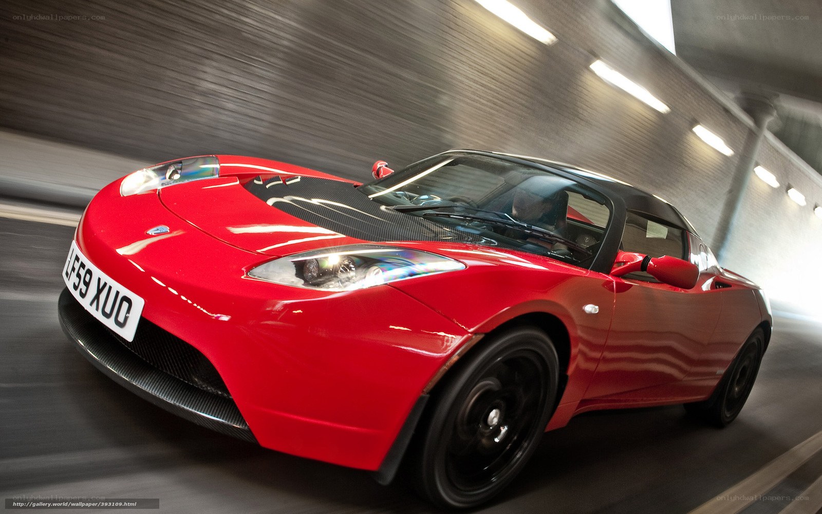 Red Tesla Roadster in tunnel