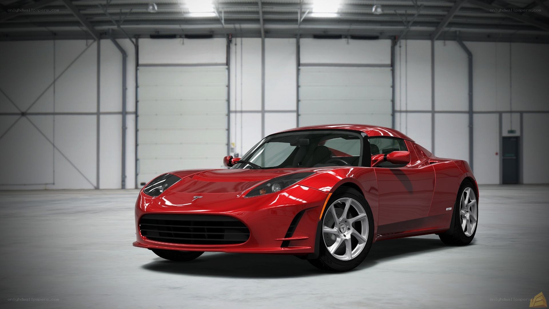 Red Tesla Roadster in warehouse