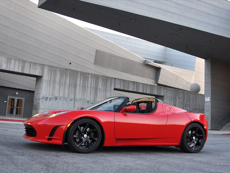 Red Tesla Roadster parked
