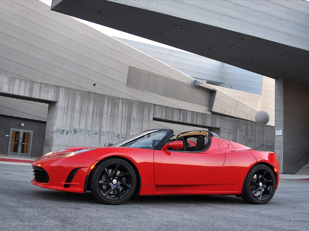 Red Tesla Roadster parked