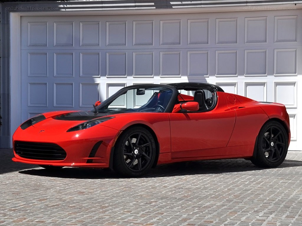 Red Tesla Roadster parked