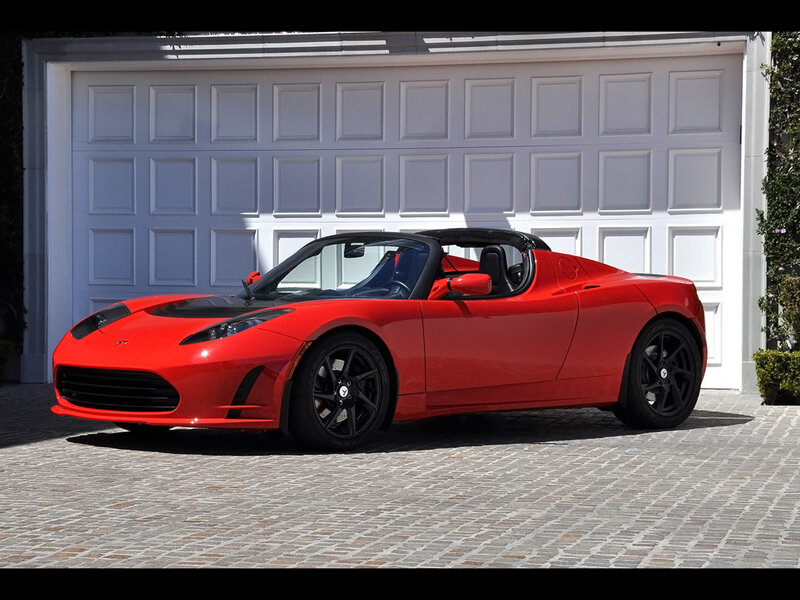 Red Tesla Roadster parked