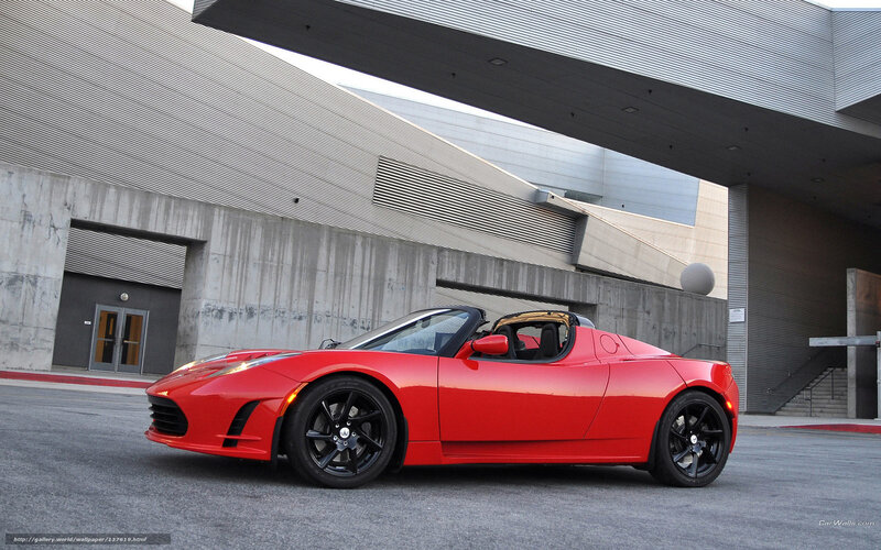 Red Tesla Roadster parked