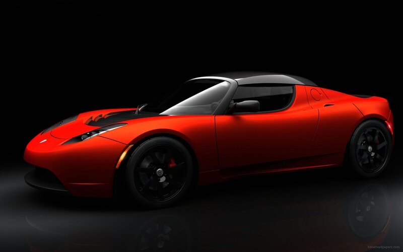 red tesla roadster sports car