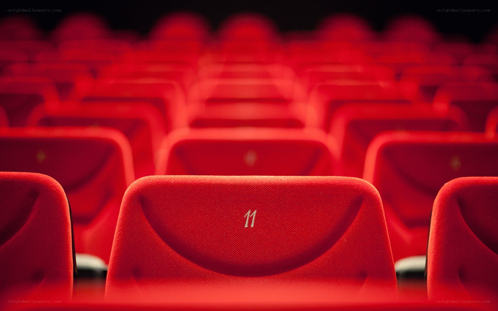 Red theater seats in rows