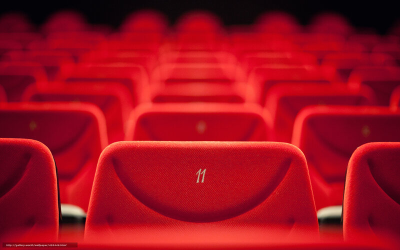 Red theater seats in rows