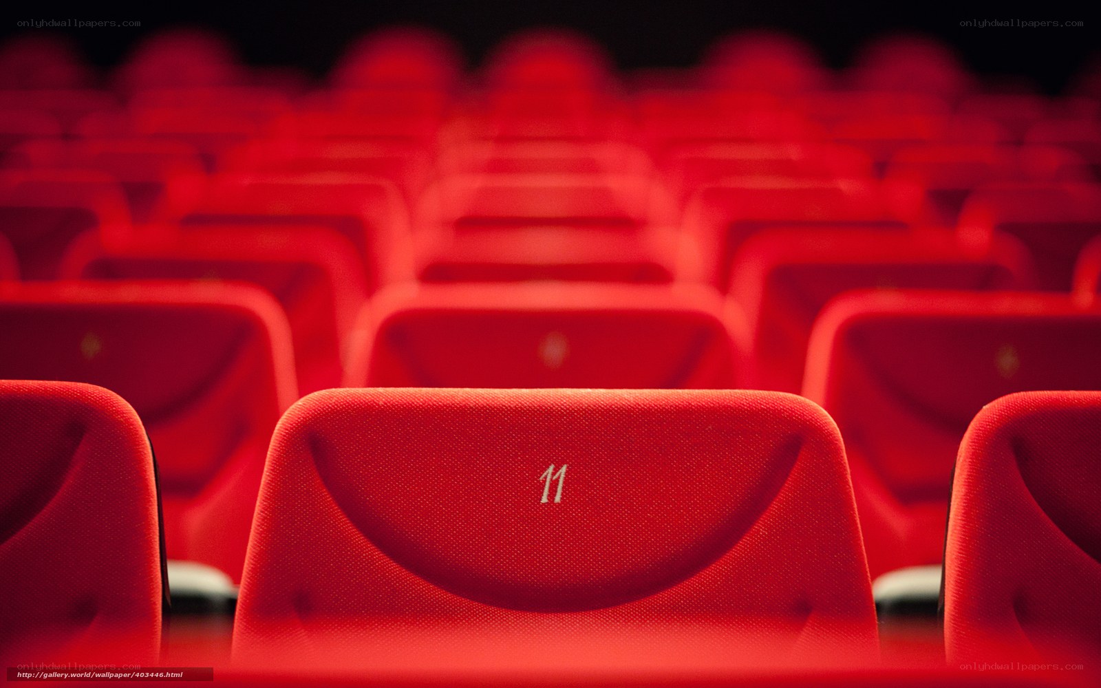 Red theater seats in rows