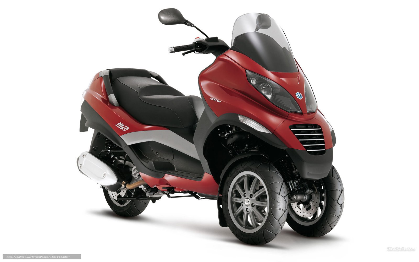 Red three-wheeled scooter