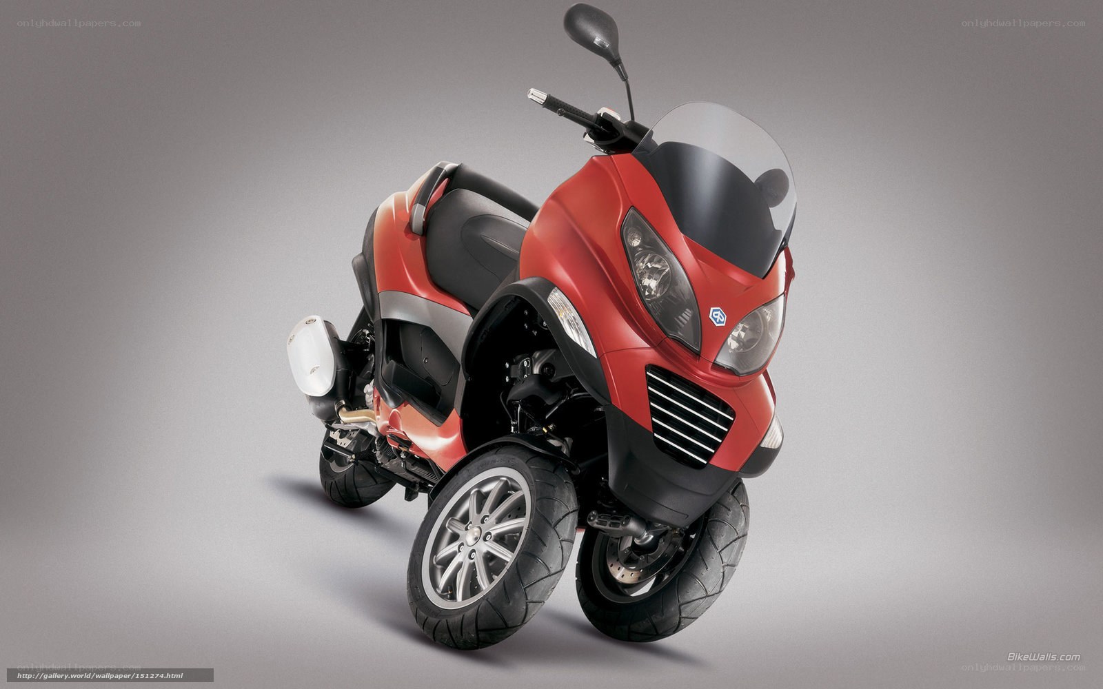 Red three-wheeled scooter