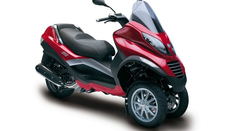 red three-wheeled scooter